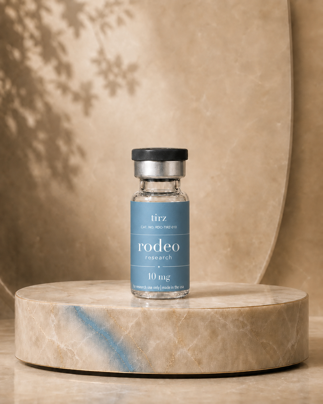 TIRZ 10 mg rodeo research vial on a stone pedestal